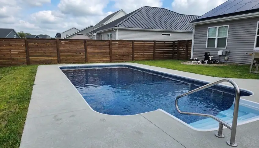 Vinyl liner pool with concrete deck and stainless handrail in Atlanta GA